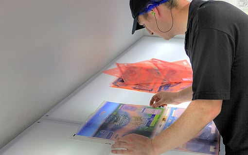 A Mondi colleague examines printed packaging.