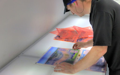 A Mondi colleague examines printed packaging.