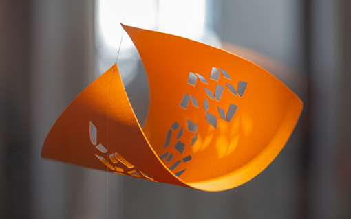 Paper cut into an artistic design.