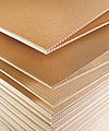 Close-up image of fanfold corrugated cardboard.