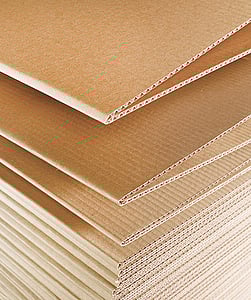 Close-up image of fanfold corrugated cardboard.