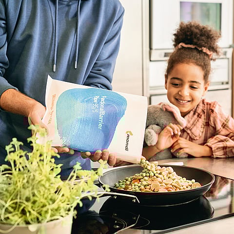 Mondi sustainable food packaging child in kitchen