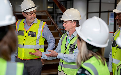 Mondi CEO Andrew King talking with colleagues in plant