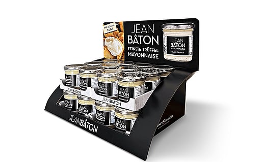 A counter display featuring tins of mayonnaise.