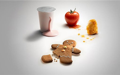 gingerbreadman with broken foot, tomato, spilled milkshake and chicken nugget on a white background