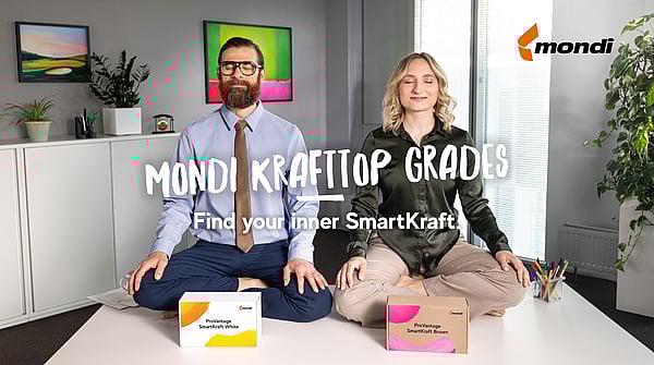 two people meditating with cardboard boxes
