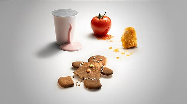 gingerbreadman with broken foot, tomato, spilled milkshake and chicken nugget on a white background