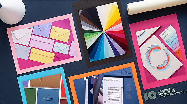 packshots of colourful printing paper on a black background