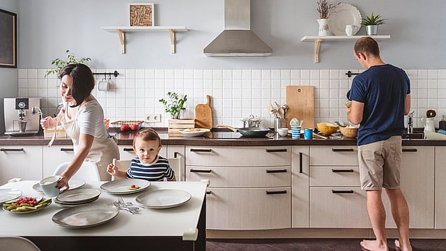 A family in their kitchen preparing food.