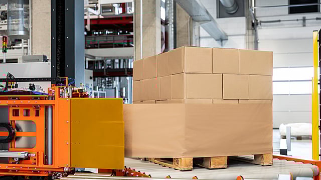 large packages being wrapped in a factory
