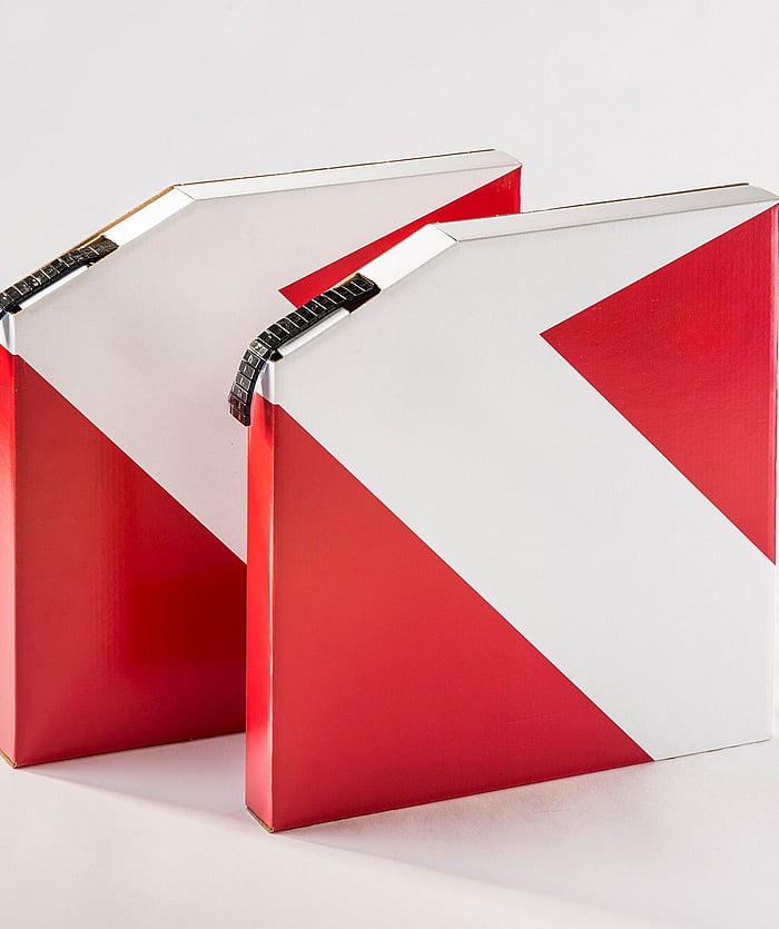 A space-saving corrugated packaging solution designed for flat automotive components.