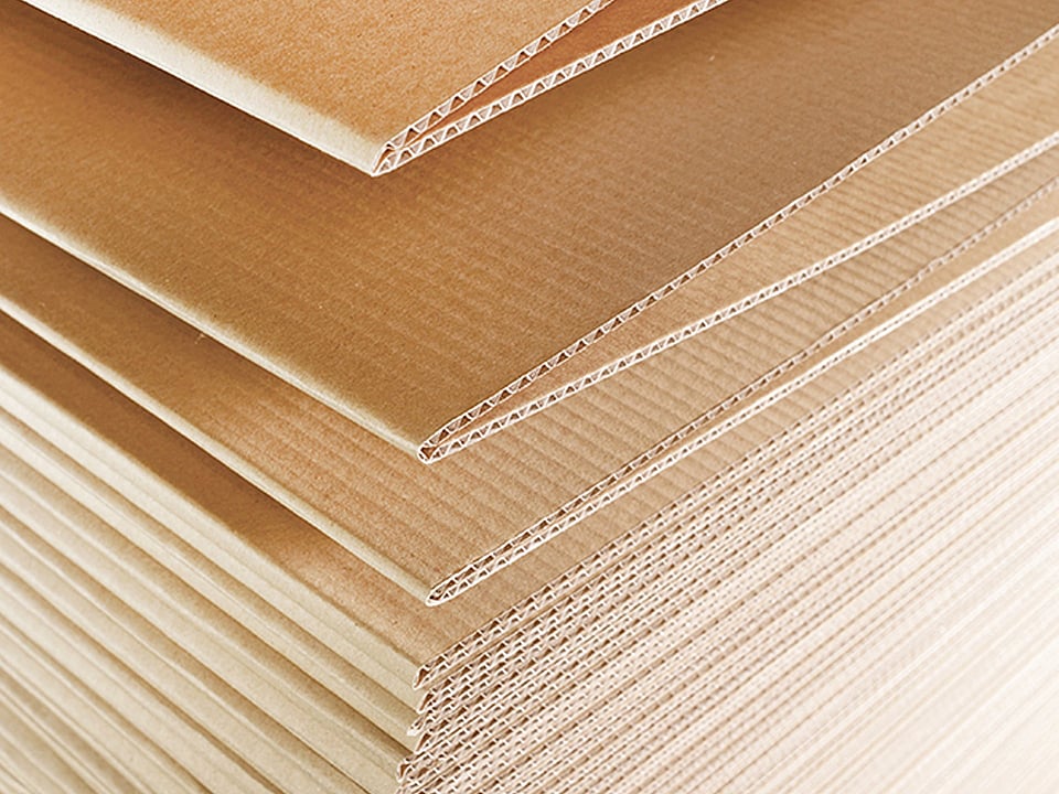 Close-up image of fanfold corrugated cardboard.
