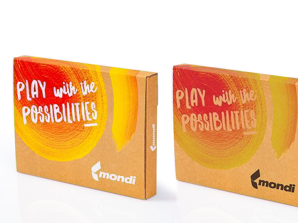 Two Mondi packaging boxes featuring red and yellow brushstrokes, with the phrase 'Play with the possibilities' displayed in the top-left corner and Mondi's logo positioned in the bottom-right corner