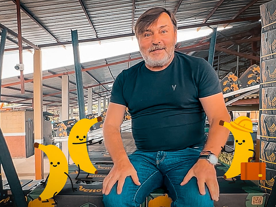 Marek Motylewski from Mondi, surrounded by corrugated boxes filled with bananas.