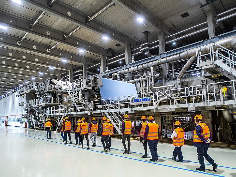 Customers walking alongside PM10 paper machine
