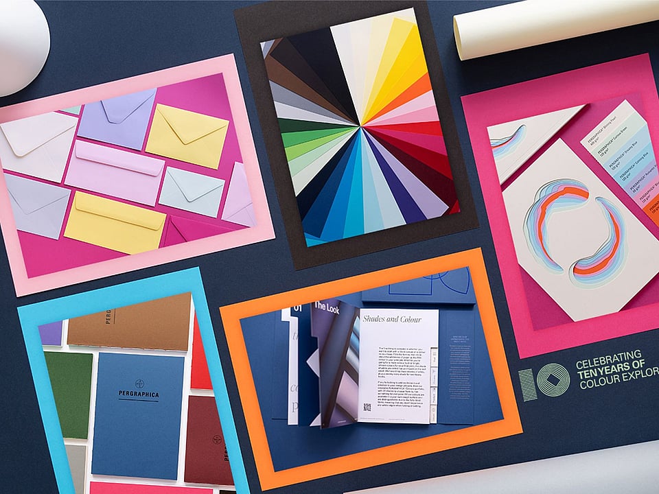 packshots of colourful printing paper on a black background