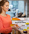 A woman holding a corrugated box with the words ProVantage SmartKraft White written on it.