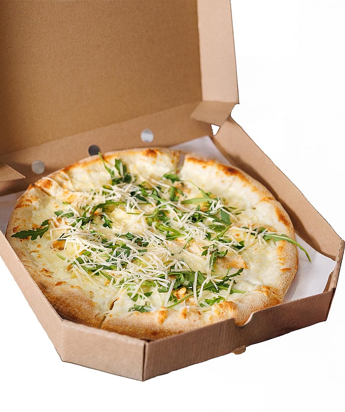 A pizza box with a pizza.