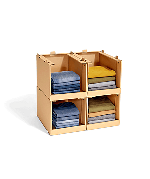 Shelf made of corrugated cardboard filled with sweaters.