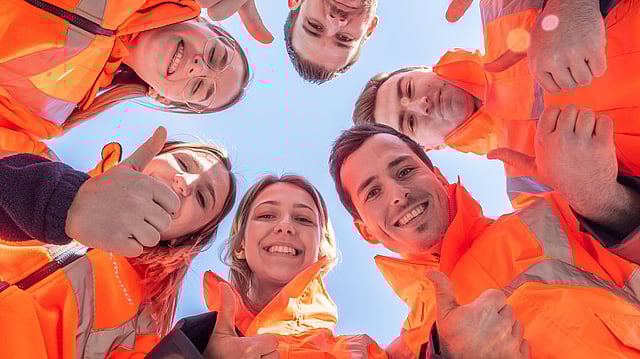 Mondi employees wearing orange jackets