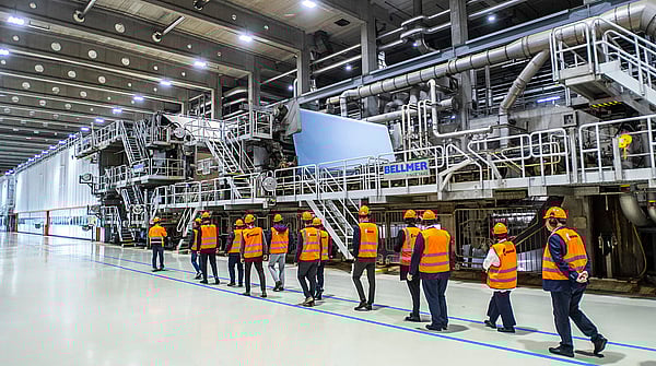 Customers walking alongside PM10 paper machine