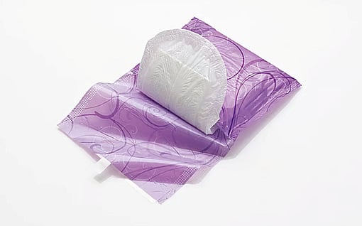 Single-wrap film and wicket bag packaging for sanitary napkins