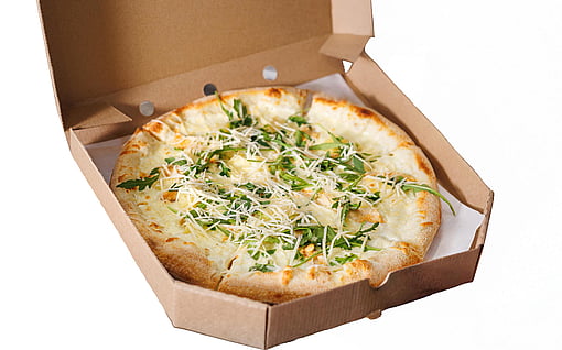 A pizza box with a fresh pizza.