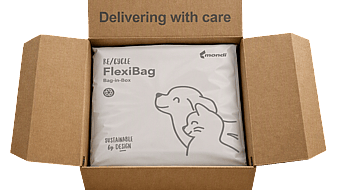 corrugated box open with packaging inside featuring a dog and text