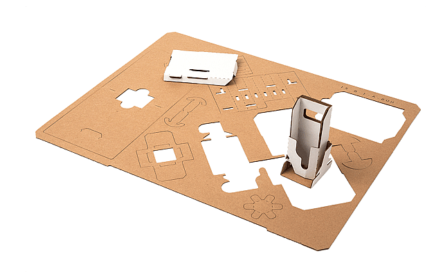 A corrugated board with die-cutting lines and the final packaging product placed into one of the cut-out holes.