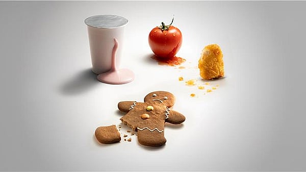 gingerbreadman with broken foot, tomato, spilled milkshake and chicken nugget on a white background